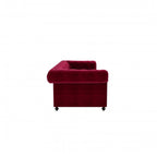 Homecrest Oakley Chesterfield sofa in pomegranate red velvet with tufted detailing, side view