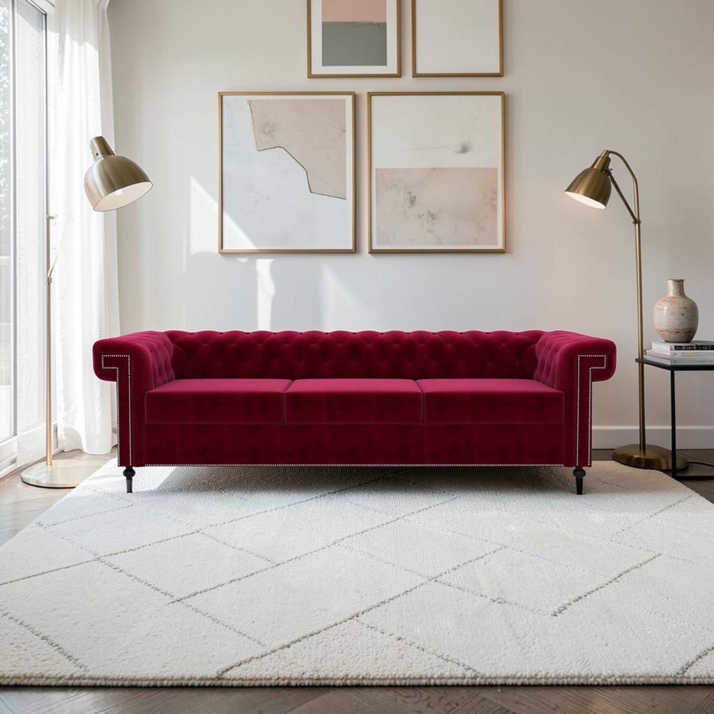 Homecrest Oakley three-seater Chesterfield sofa in pomegranate red velvet with tufted back and nailhead trim