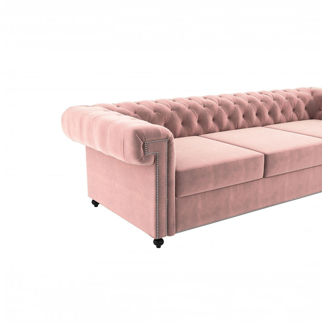 Homecrest Oakley rose dust velvet Chesterfield sofa with tufted backrest and silver nailhead trim details.
