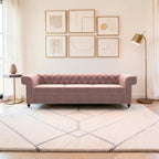 Homecrest Oakley Chesterfield sofa in rose dust velvet with button tufting and nailhead trim in a modern living room