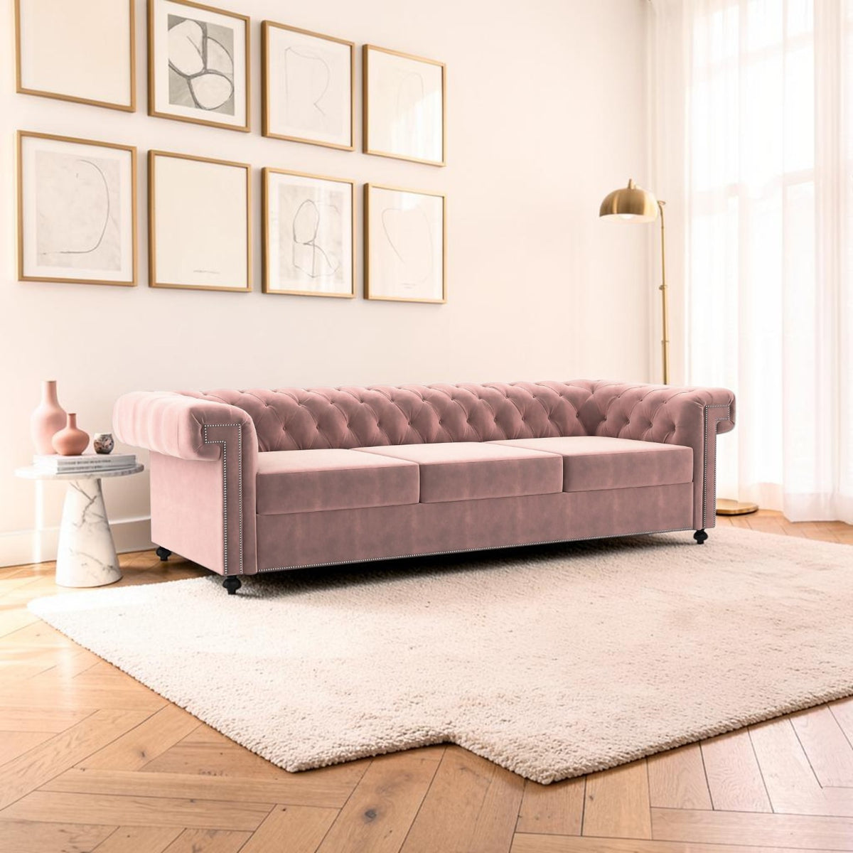 Homecrest Oakley three-seater Chesterfield sofa in rose dust velvet with tufted back and silver nailhead trim
