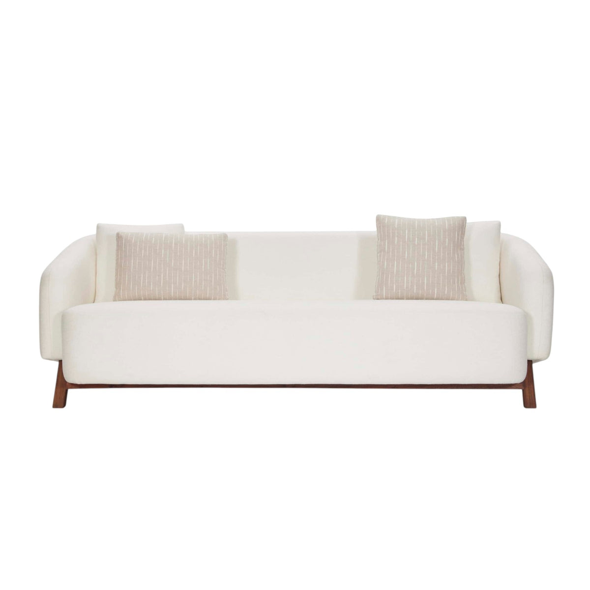Homecrest Orbell wrap-arm curved sofa in cream fabric with sculptural teak wood legs and two decorative throw pillows.