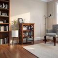 Homecrest Perrin compact sheesham bookshelf with open shelves and two base drawers in a natural wood finish