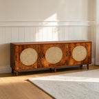Homecrest Petra three-door media cabinet in honey-finished sheesham wood with round cane rattan door inserts.