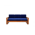 Homecrest Pilton wooden sofa with a rich walnut finish frame and deep blue fabric cushions in a modern design.