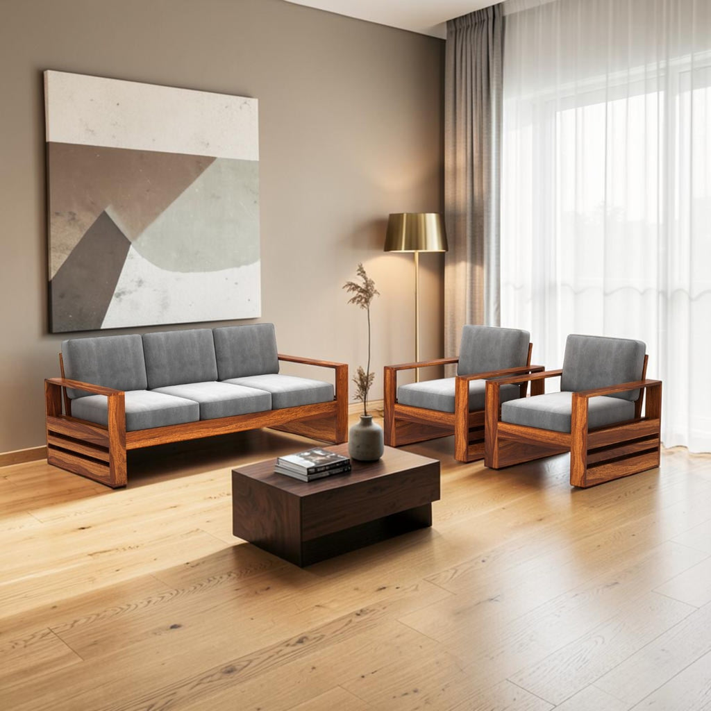 Homecrest Pilton wooden sofa set with grey fabric cushions and walnut-finished sheesham wood frames in a living room.