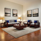 Homecrest Pilton 5 seater sofa set with grey fabric cushions, dark wood frame, and blue accent pillows in a living room