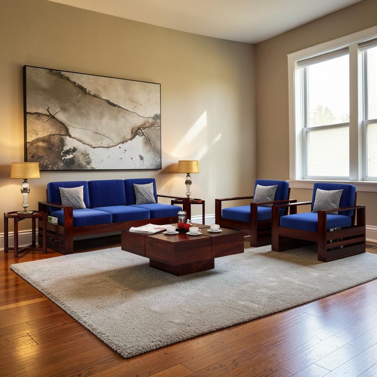 Homecrest Pilton 5-seater sofa set with blue fabric cushions and dark walnut sheesham wood frames in a living room.