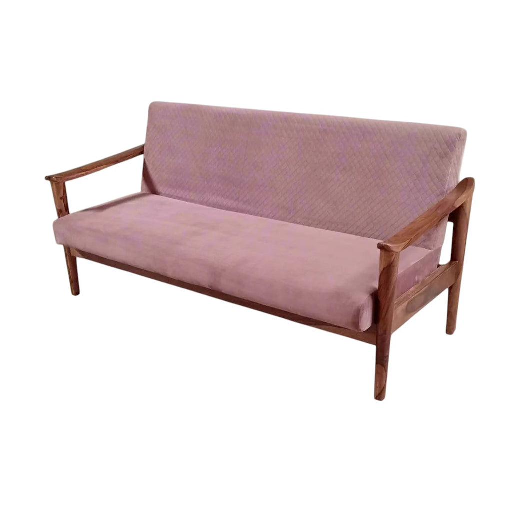 Homecrest contemporary sofa with a solid sheesham wood frame and pink quilted velvet upholstery in a bright room.