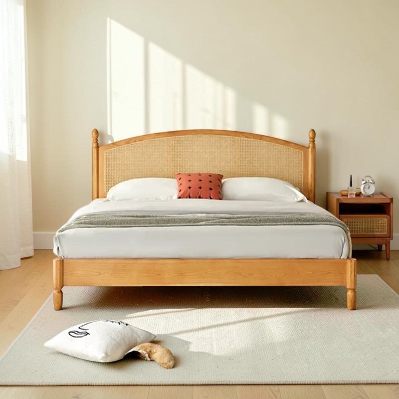 Homecrest mid-century style bed frame in natural acacia wood with a woven rattan cane headboard in a bright bedroom.