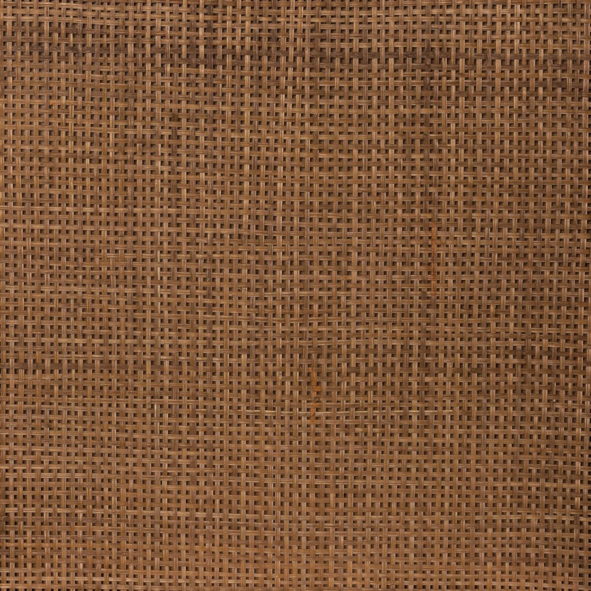 Close-up of the Homecrest rattan headboard featuring a detailed woven texture in a warm walnut brown finish.