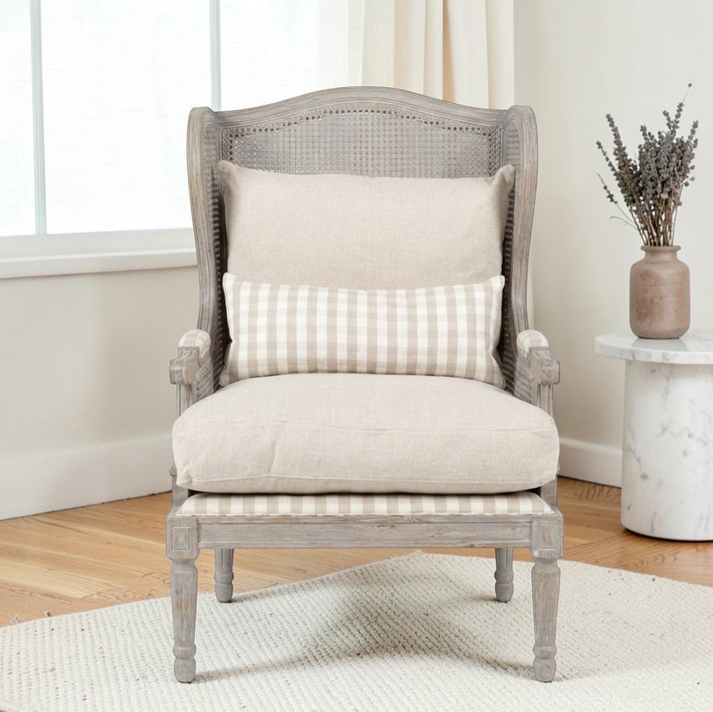 Homecrest Ridlington armchair featuring a grey solid wood frame, rattan backrest, and beige upholstered cushions.
