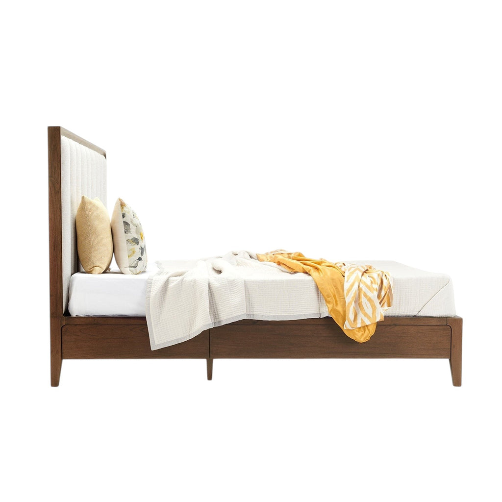 Homecrest Rushden teakwood bed with a tall paneled upholstered headboard in marble fabric, side profile view.