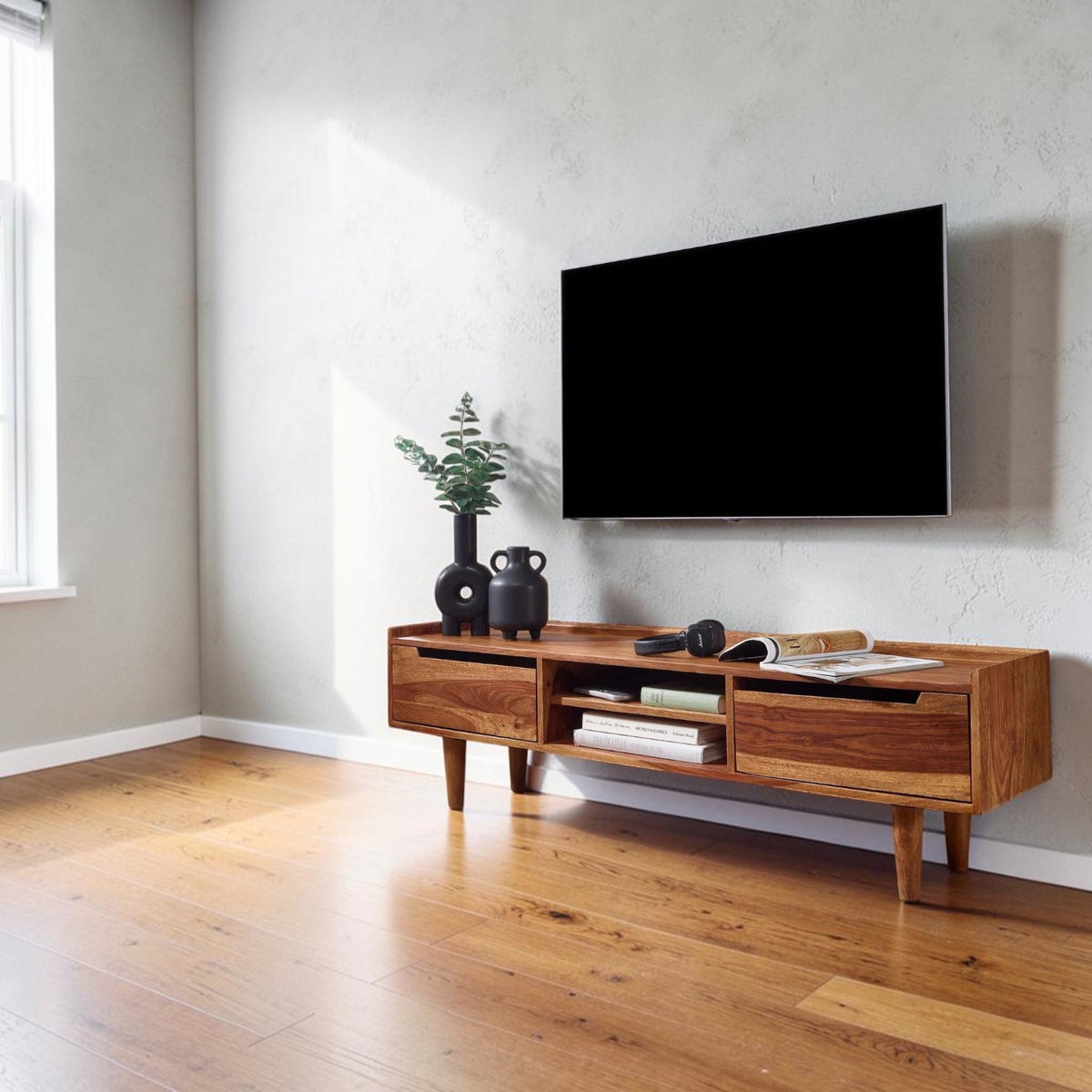 Homecrest Rowley solid wood media cabinet in a warm walnut finish with two drawers and an open center shelf.
