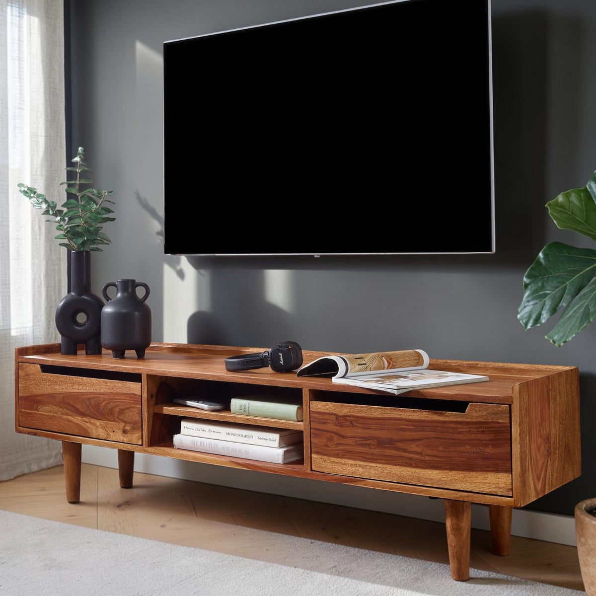 Homecrest Rowley solid wood media cabinet with two drawers and an open shelf in a warm natural wood finish