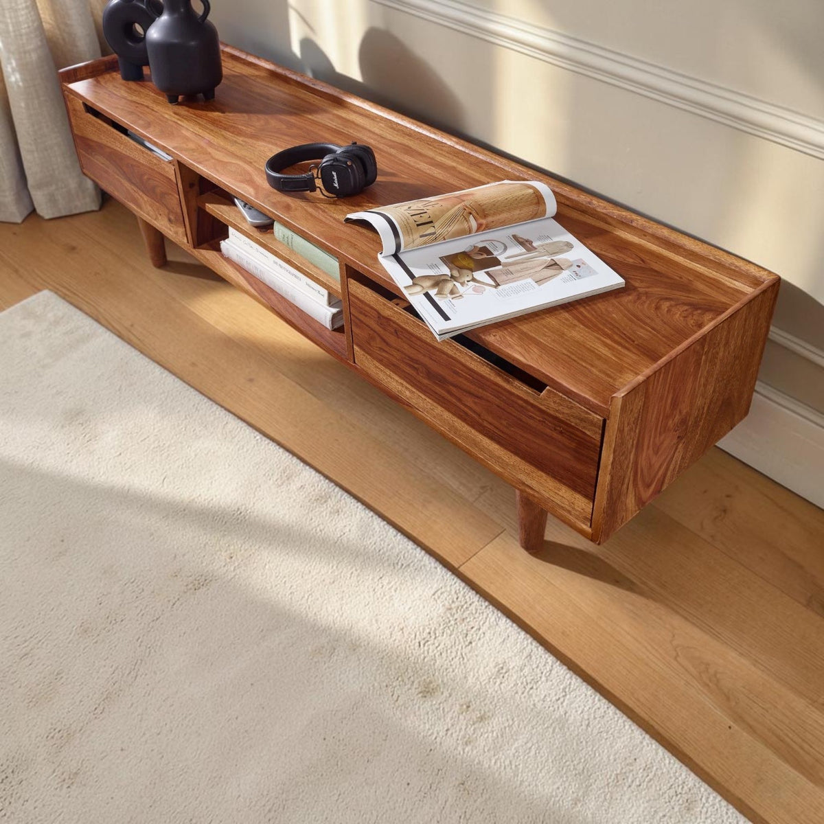Homecrest Rowley solid wood media cabinet in a rich honey finish with open shelving and a low-profile design.
