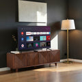 Homecrest Sabine fluted media cabinet in walnut solid sheesham wood with four doors and gold-toned profile handles.