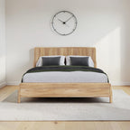 Homecrest modern Scandinavian platform bed with natural wood finish and slatted headboard in a minimalist bedroom.
