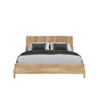Homecrest modern Scandinavian platform bed with a natural wood slatted headboard and white bedding