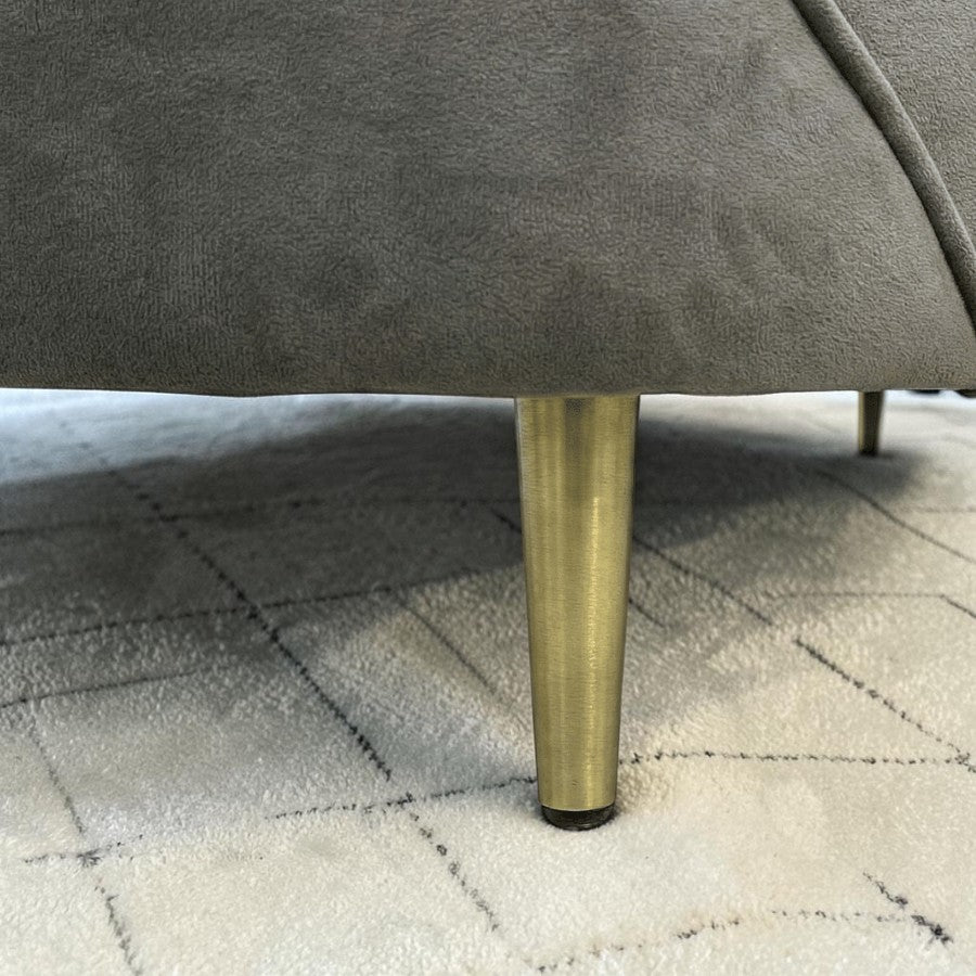 Homecrest Calvert sofa featuring plush grey velvet upholstery and a tapered metallic gold leg on a white background.