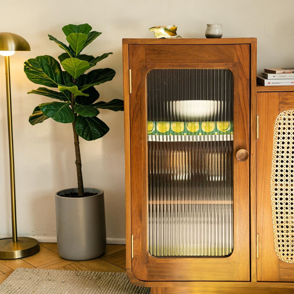 Homecrest Selby sideboard in teak wood featuring a fluted glass cabinet door and handwoven wicker cupboard detail.