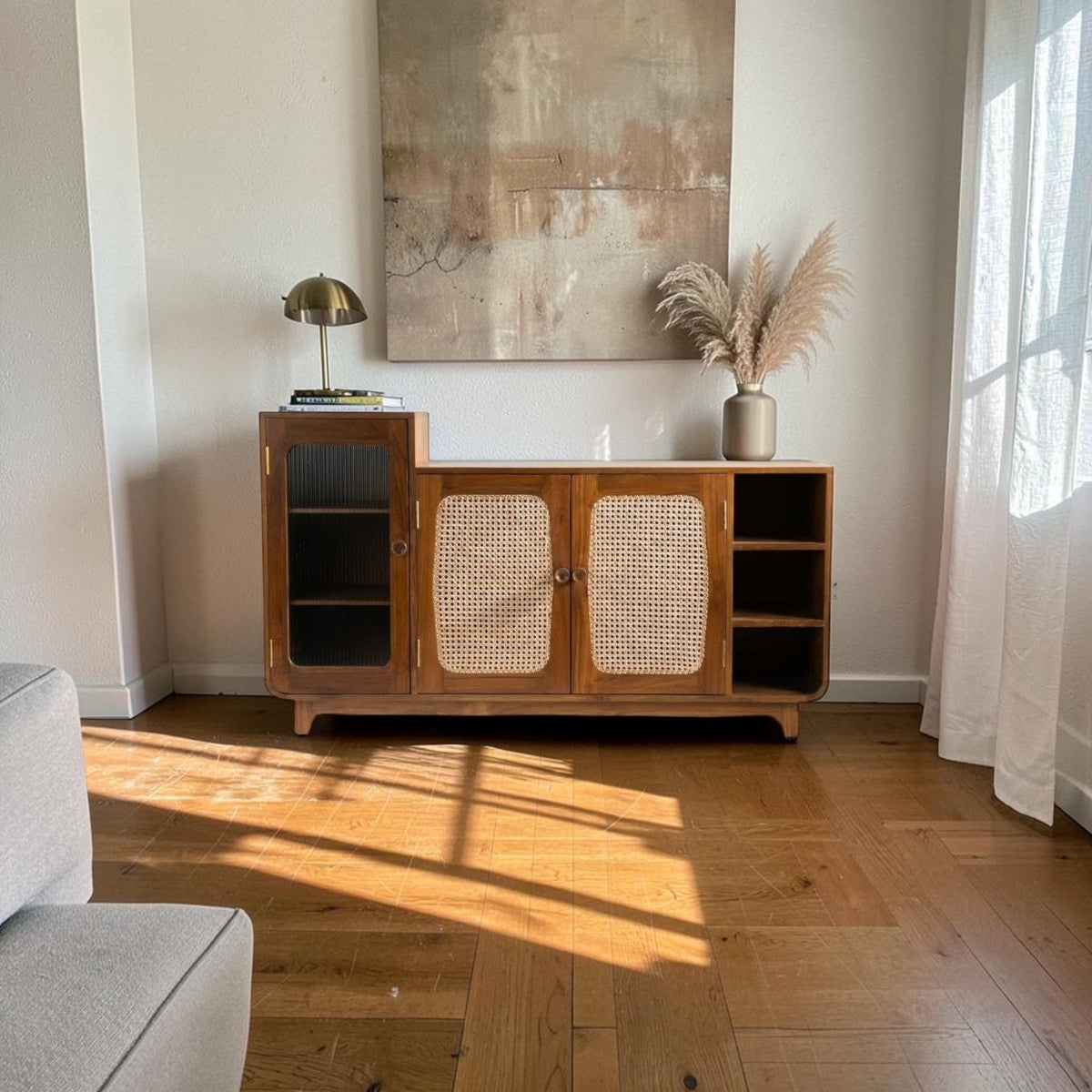 Homecrest Selby sideboard in medium teak with fluted glass, handwoven wicker doors, and open shelving in a living room