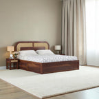 Homecrest Rhodin Sheesham wood bed with walnut finish, cane headboard detailing, and convenient hydraulic storage.