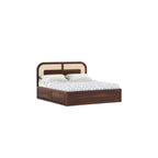Homecrest Rhodin Sheesham wood king bed with walnut finish, cane headboard detailing, and hydraulic storage base.