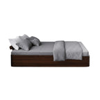 Homecrest Neave solid Sheesham wood storage bed in dark finish with grey bedding, shown from a side profile view.