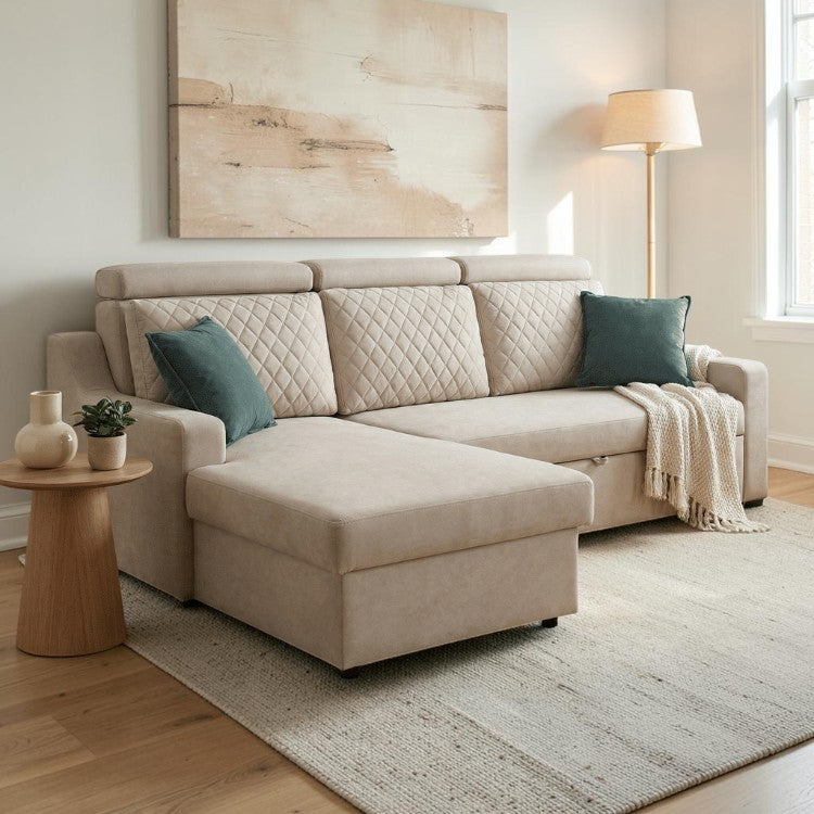 Homecrest Silchester L-shape sofa in beige fabric with diamond-quilted back cushions and teal accent pillows in a living room