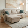 Homecrest Silchester L-shape sofa in beige fabric with diamond-quilted back cushions and teal accent pillows in a living room