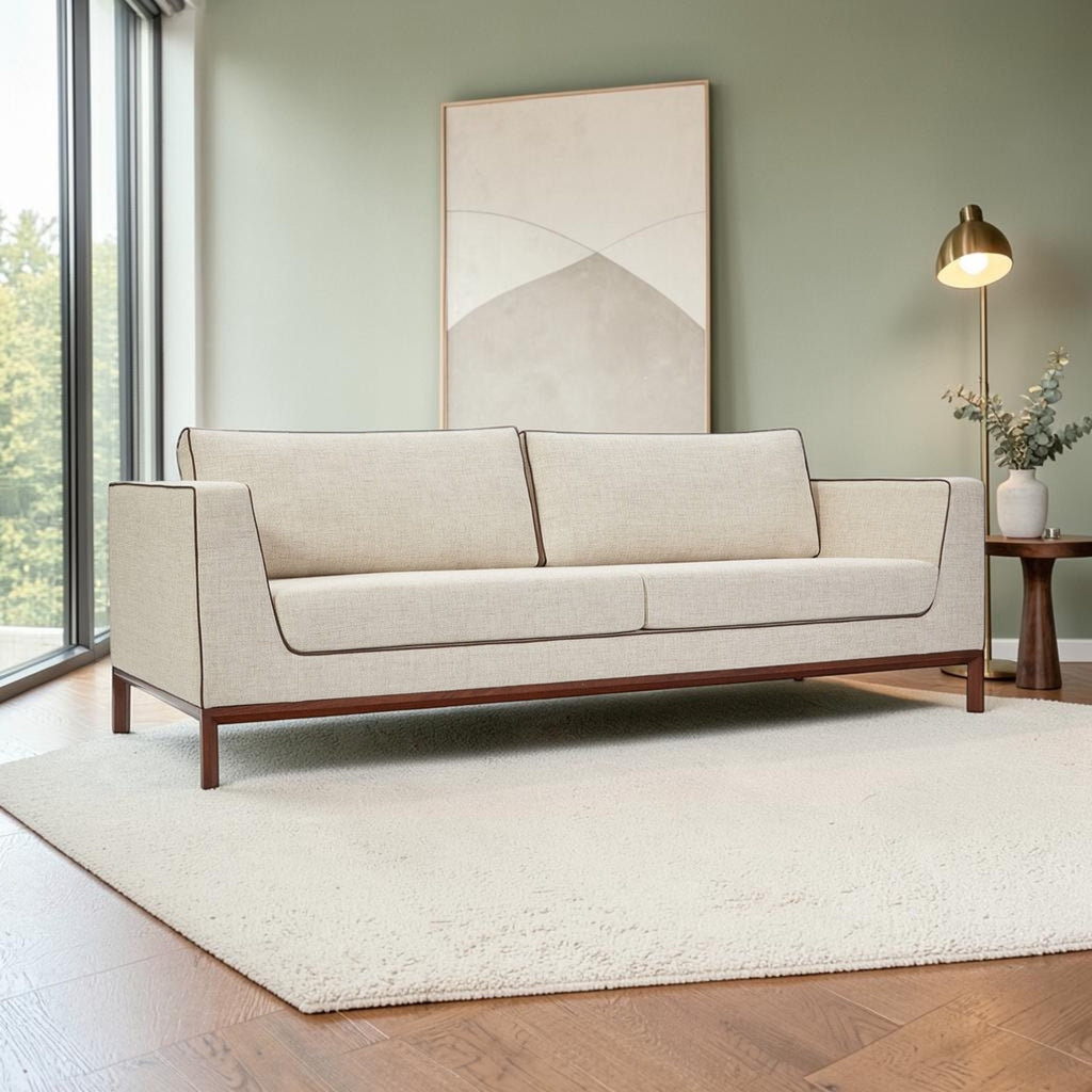 Homecrest Solace deep-seat lounge sofa in ivory fabric with brown contrast piping on a solid teakwood base frame.