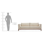 Homecrest Solace deep-seat lounge sofa with ivory upholstery, contrast piping, and a teakwood base, shown with scale.