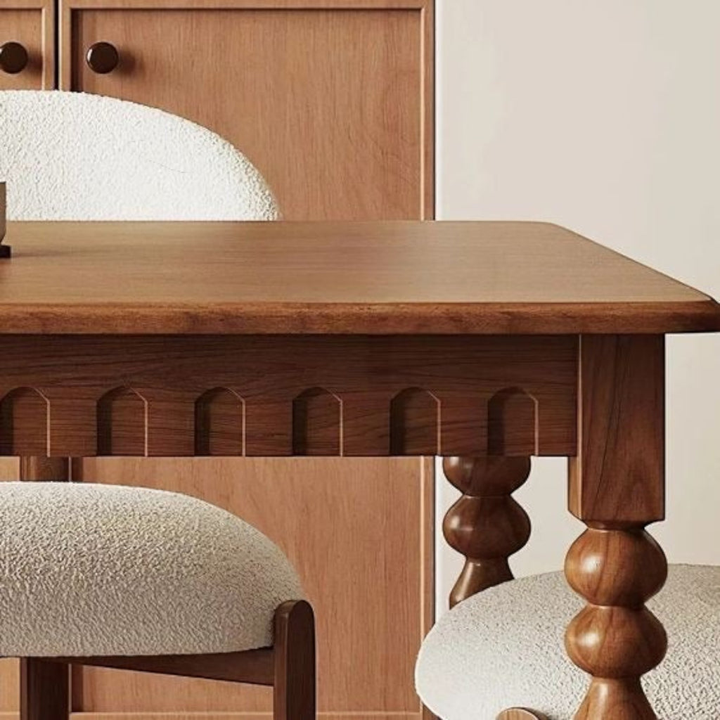 Homecrest Solene solid mango wood dining table with a rectangular top and decorative carved apron detail.
