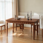 Homecrest Solene rectangular dining table in solid mango wood with a natural finish and carved apron detail.