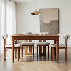 Homecrest Solene solid mango wood rectangular dining table with a natural finish in a bright modern dining room.