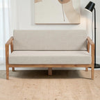 Homecrest 2-seater sofa with a natural solid wood frame and beige fabric upholstered cushions in a minimalist style