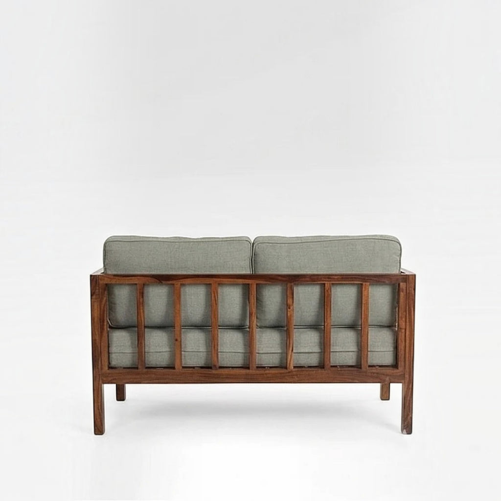 Homecrest 2-seater sofa with a solid wood frame in walnut finish, featuring grey upholstered cushions and back view.