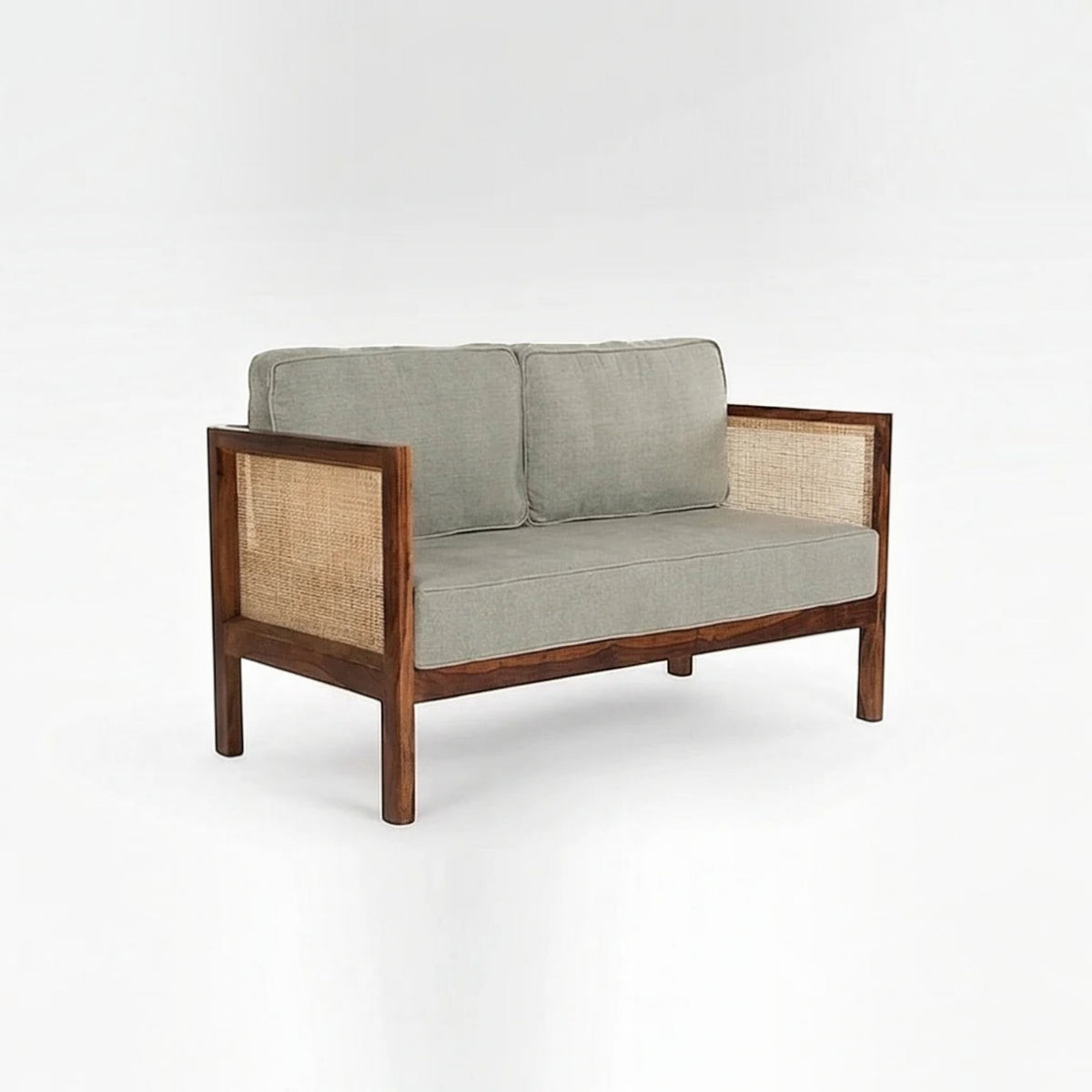 Homecrest 2-seater sofa with a rich walnut solid wood frame, natural cane side panels, and grey fabric cushions.