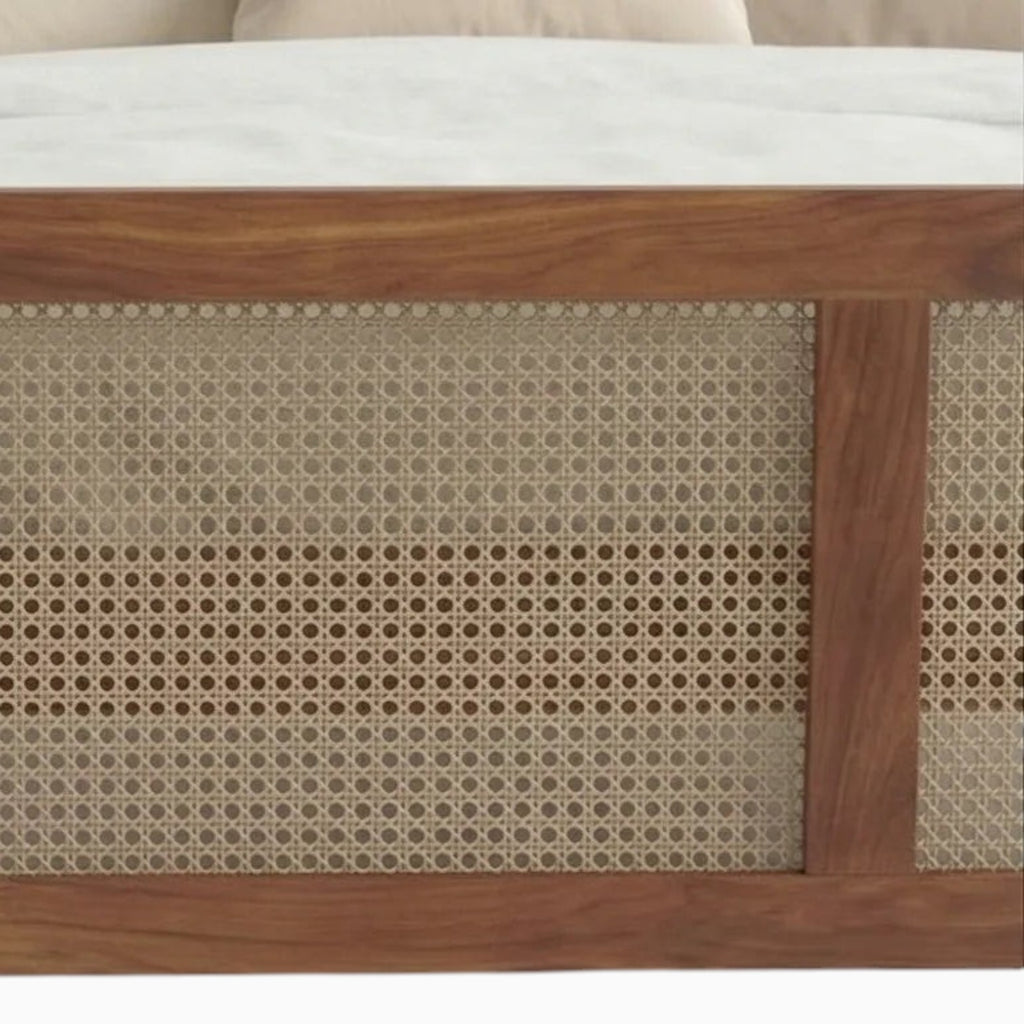 Homecrest solid wood bed frame featuring intricate handwoven rattan cane detailing on the footboard