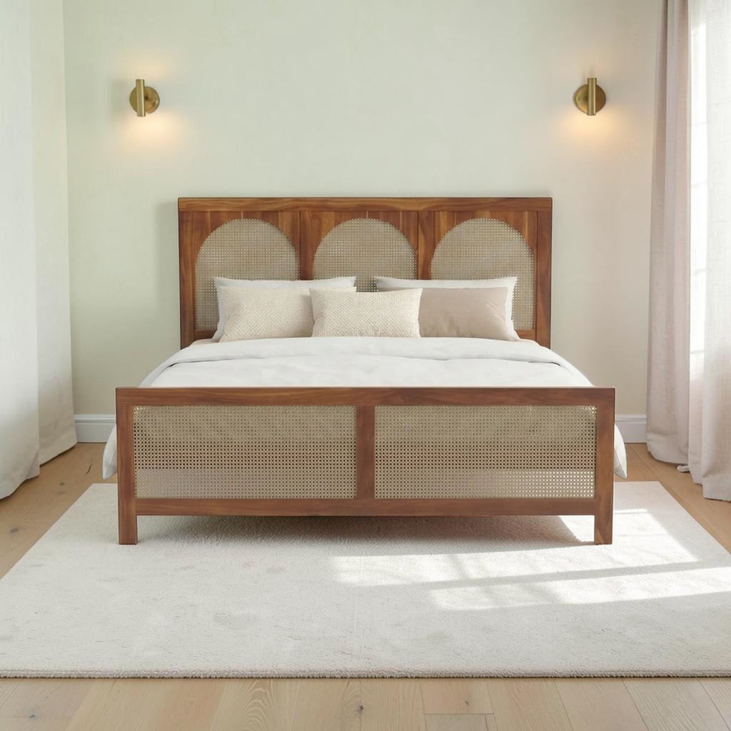 Homecrest solid wood bed frame with triple arch rattan headboard and matching cane footboard in a natural finish.