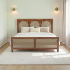 Homecrest solid wood bed frame with triple arch rattan headboard and matching cane footboard in a natural finish.