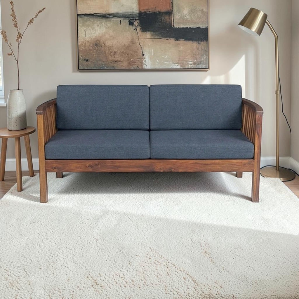 Homecrest contemporary solid wood 2-seater sofa with dark grey fabric cushions and elegant vertical slatted armrests