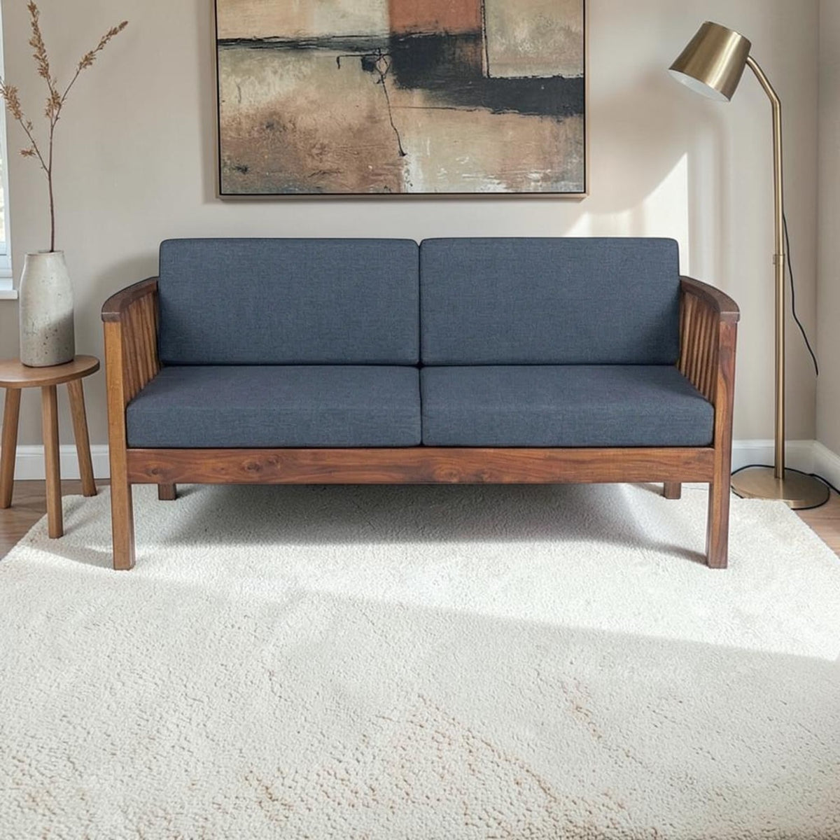 Homecrest contemporary solid wood 2-seater sofa with dark grey fabric cushions and elegant vertical slatted armrests