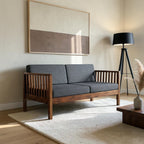 Homecrest contemporary solid wood sofa with dark grey cushions and slatted armrests in a modern living room setting.