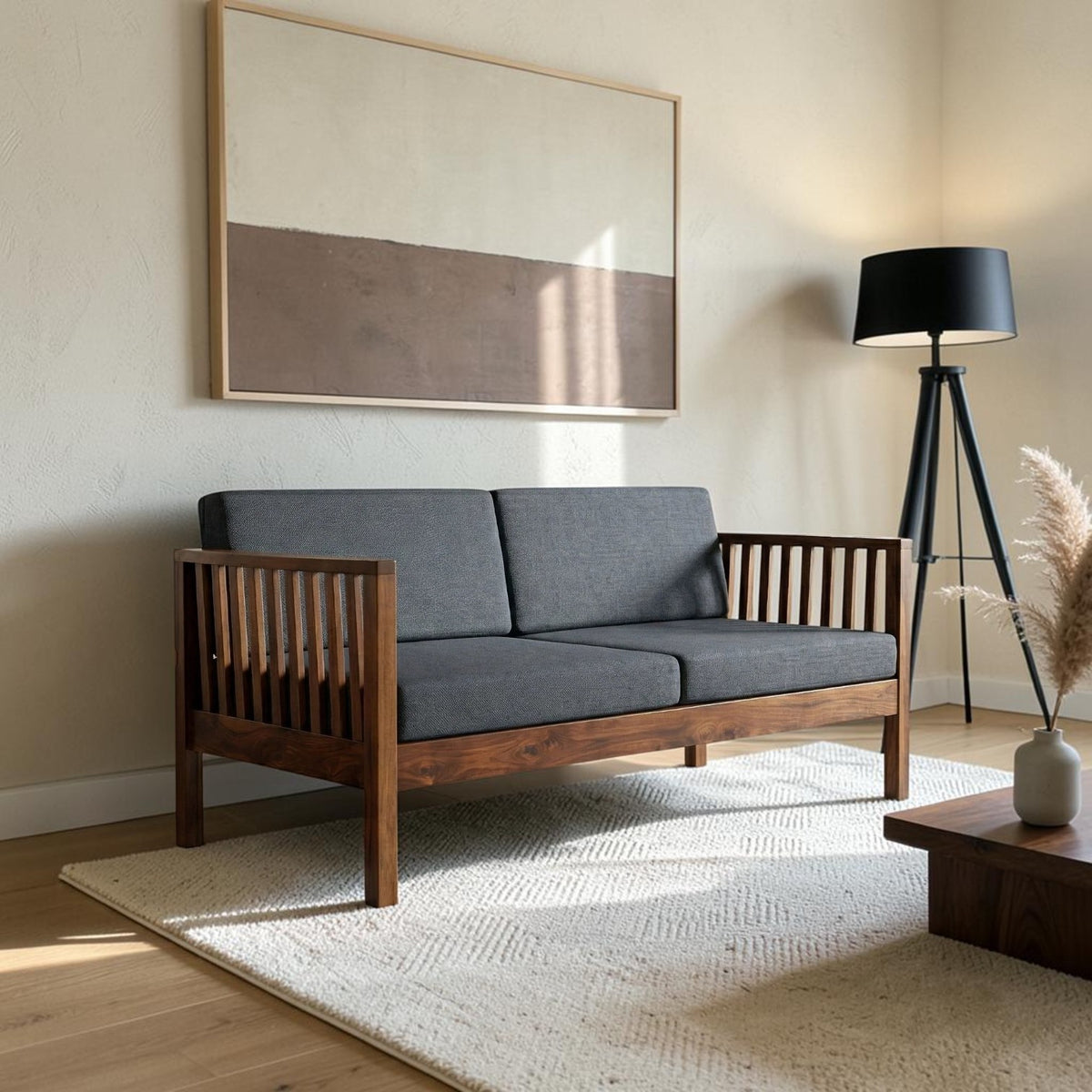 Homecrest contemporary solid wood sofa with dark grey cushions and slatted armrests in a modern living room setting.