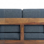 Homecrest contemporary sofa featuring a rich walnut solid wood frame with vertical slatted arms and blue fabric cushions