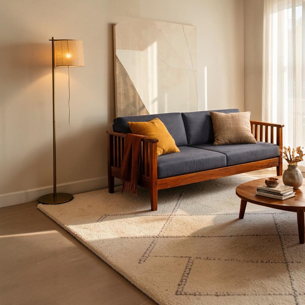 Homecrest contemporary solid wood sofa with dark grey cushions and slatted arms in a sunlit living room setting