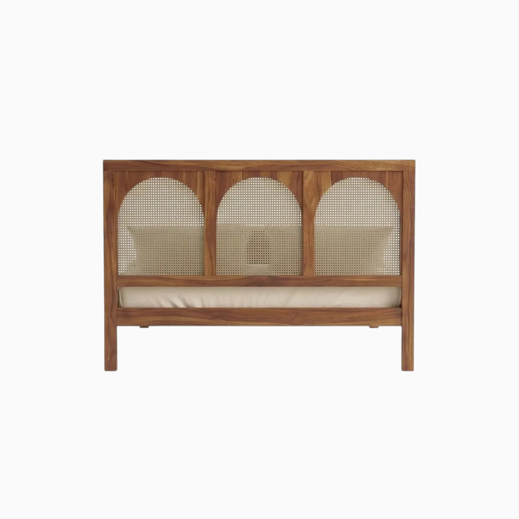 Homecrest solid wood bed frame featuring a triple arch handwoven rattan cane headboard in a natural warm wood finish.