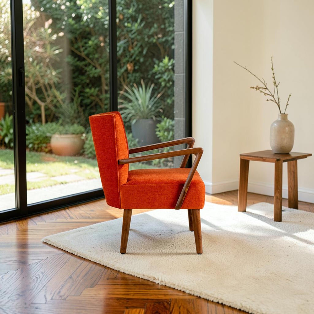 Homecrest Pelham armchair in vibrant orange fabric with a handcrafted seasoned teak wood frame in a mid-century style.